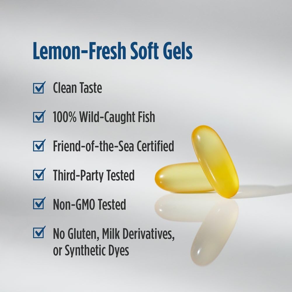 Two yellow lemon-fresh soft gel capsules on a light gray reflective surface, next to a list of product features and benefits including 'Clean Taste', '100% Wild-Caught Fish', and 'Friend-of-the-Sea Certified'.
