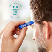 Hand applying Puressentiel roll-on to temple for soothing massage.